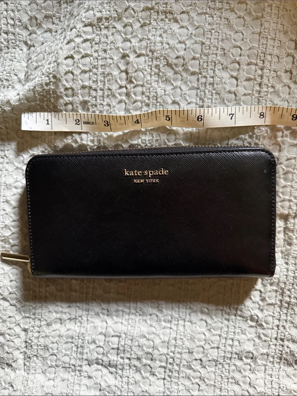 kate spade black zip-around Saffiano leather wallet with gold logo